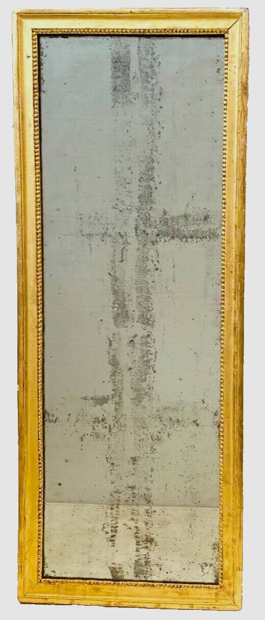 Louis XVI mirror in carved and gilded wood with leaf 18th century