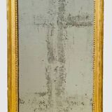 Louis XVI mirror in carved and gilded wood with leaf 18th century