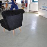 Mid-century black cocktail chair in lambskin, beech legs — 1960s