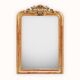 19th-century Louis-Philippe mirror with patina and pediment.