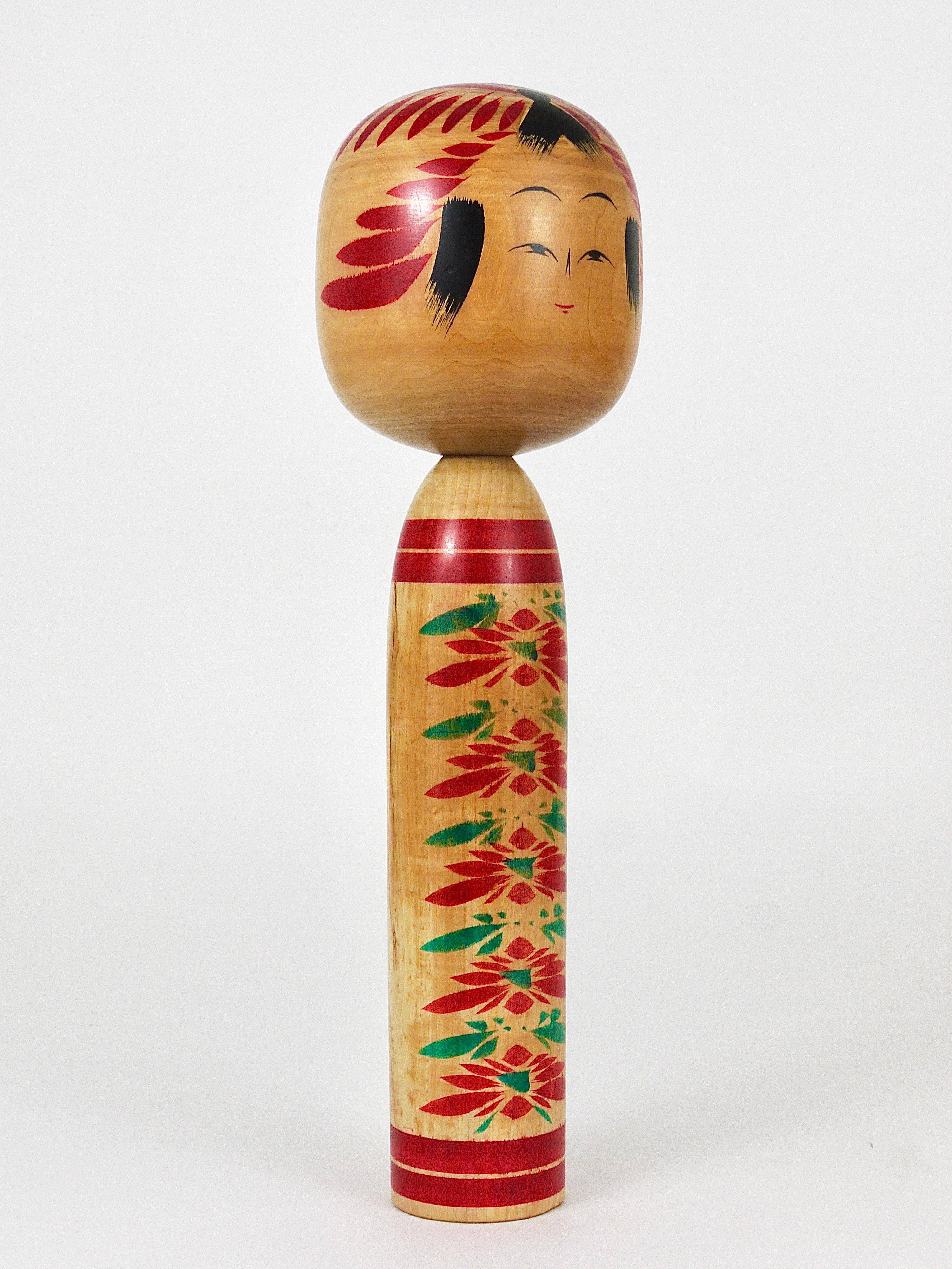 Decorative Togatta Kokeshi doll sculpture from northern Japan, hand-painted.
