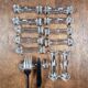 Set of 12 antique knife and fork rests in thick transparent glass.