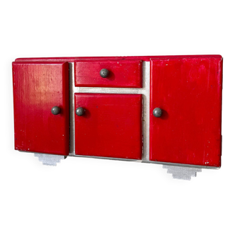 Red wooden children's toy sideboard