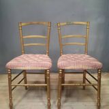 Pair of upholstered chairs in gilded wood