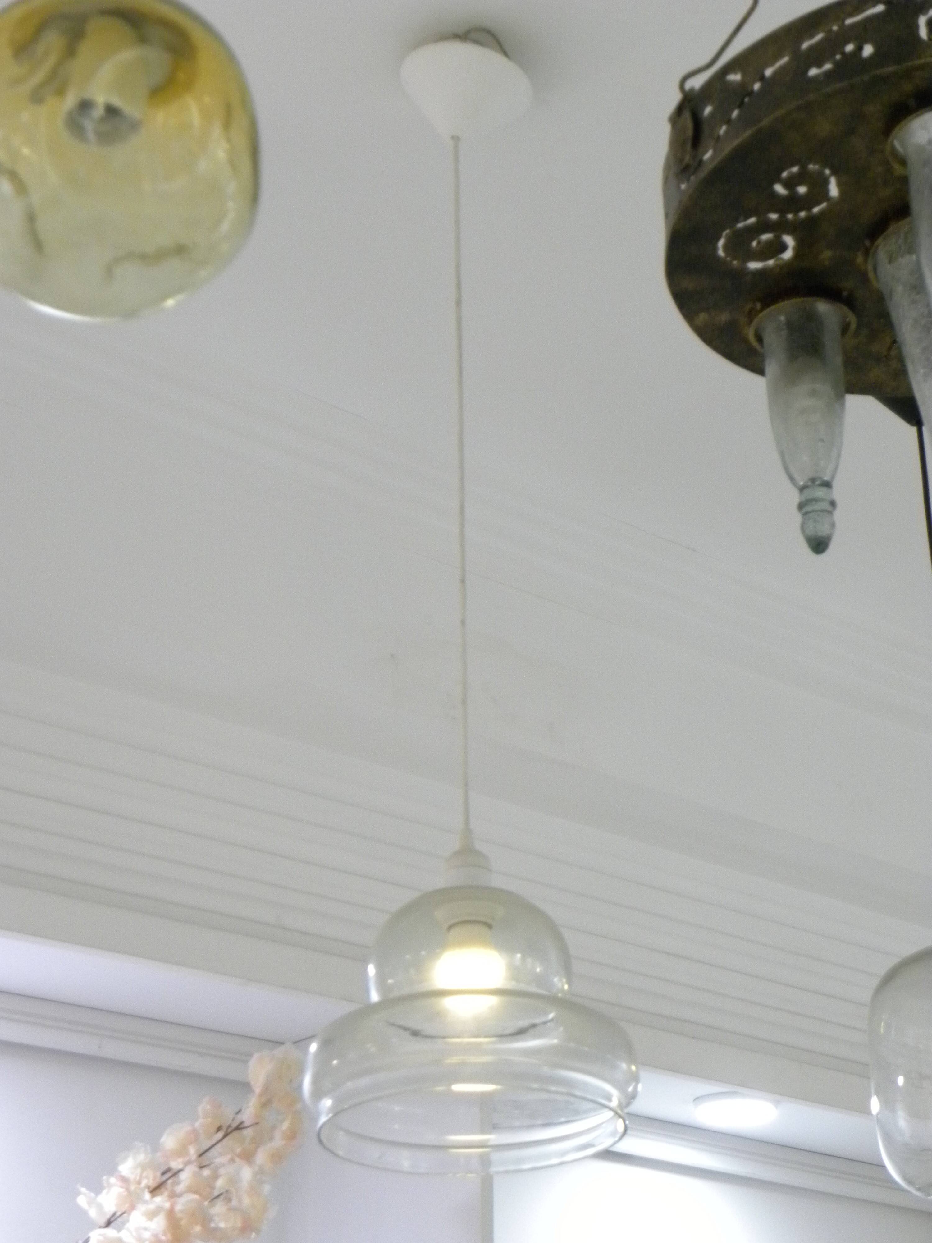 Suspended lamp in transparent blown glass, modern, minimalist, timeless style.