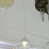 Suspended lamp in transparent blown glass, modern, minimalist, timeless style.
