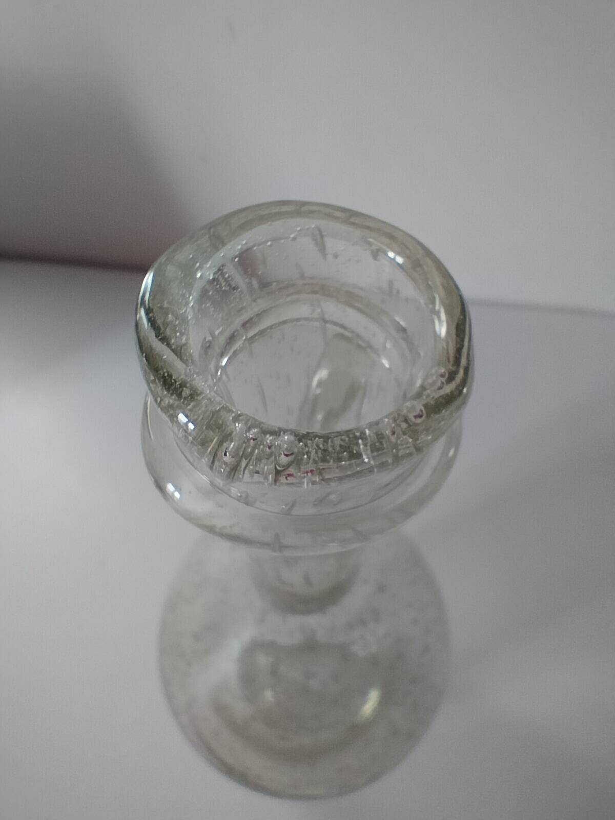 Bubble glass carafe bottle signed Biot in lime green colour.