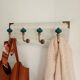 Wall-mounted coat rack in bleached wood and emerald green ceramic hooks –