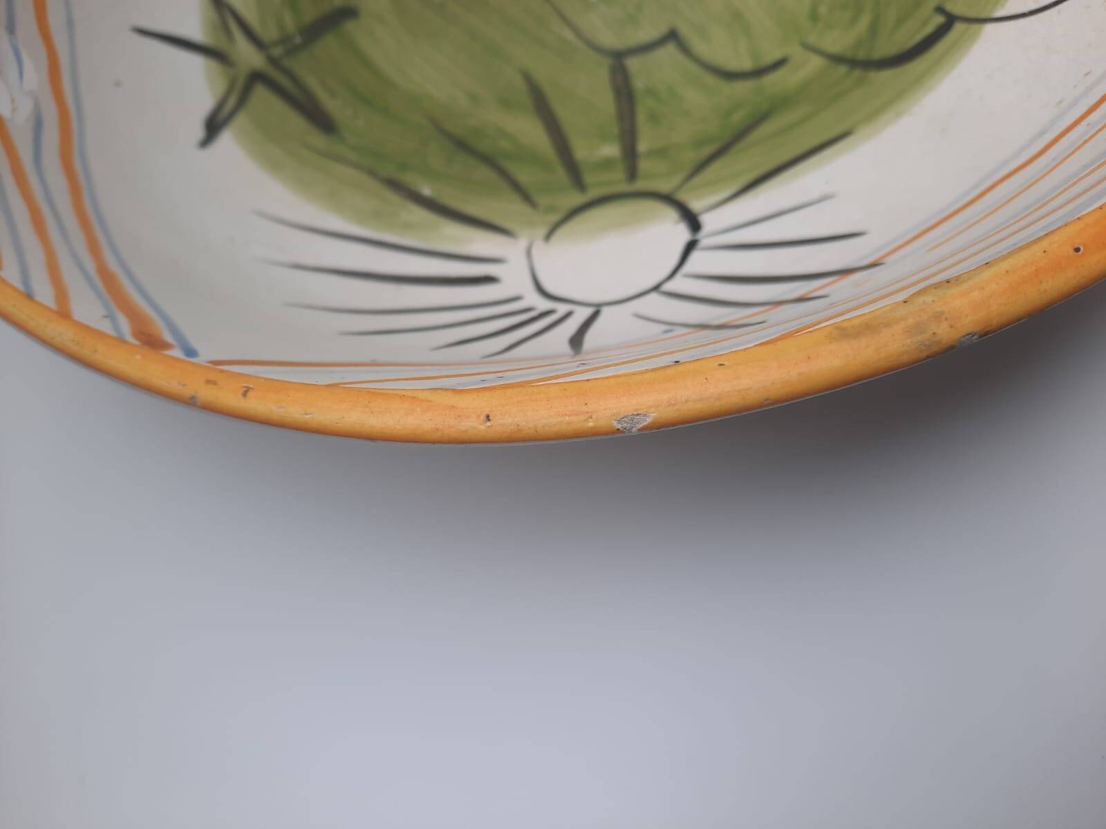Vallauris 1950 Vintage cup with sun, star, and fish patterns.