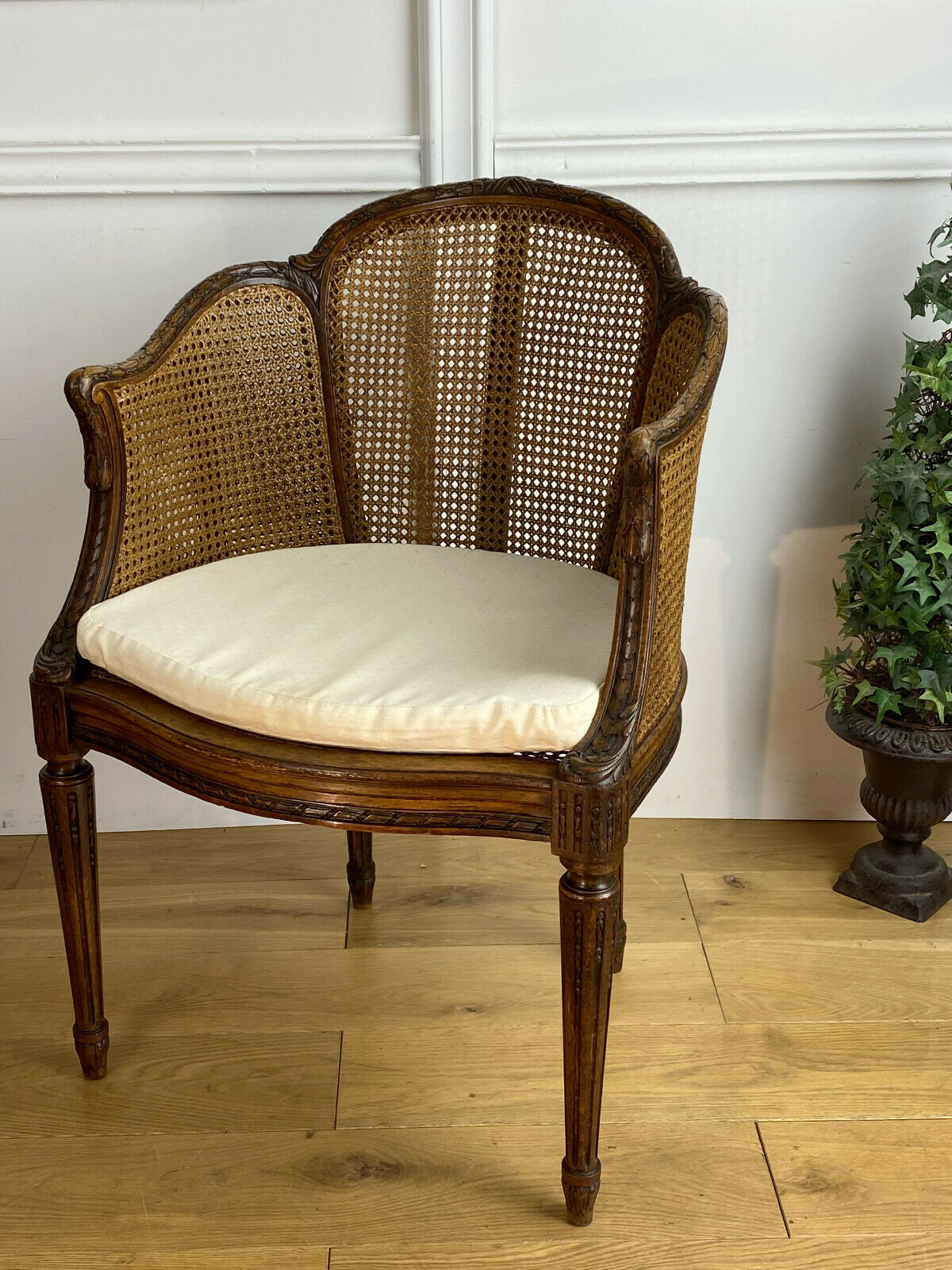 Old armchair with double cannage in walnut carved style Louis XVI of the nineteenth century