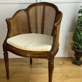 Old armchair with double cannage in walnut carved style Louis XVI of the nineteenth century