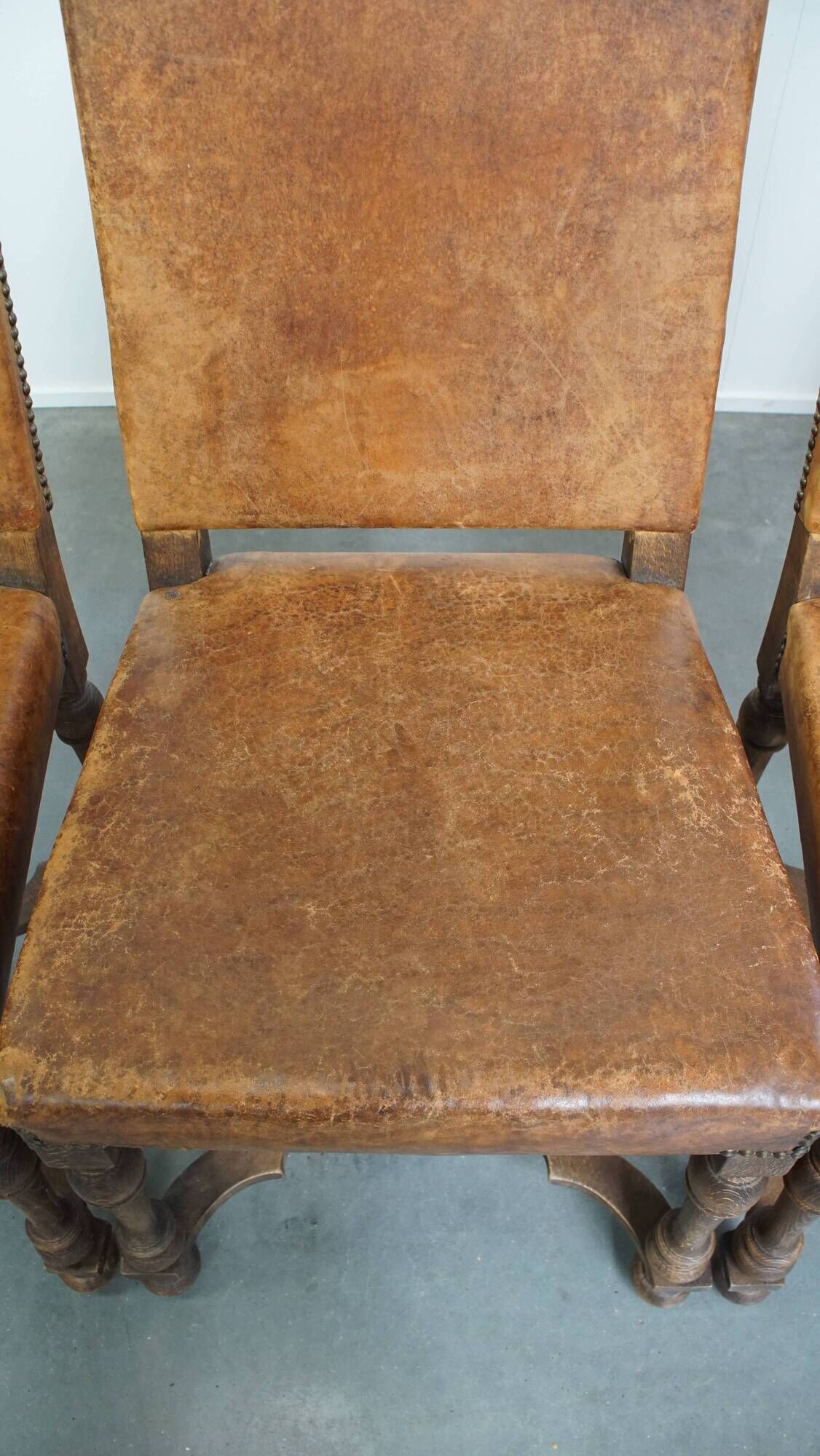 Set of 4 antique wooden and sheepskin leather dining chairs
