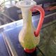 Small vintage glass vase with a red handle – Speckled green and yellow decoration