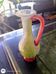 Small vintage glass vase with a red handle – Speckled green and yellow decoration