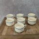 Set of 7 vintage cups Moulin des Loups – Blue and ochre trim, retro charm