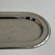 Small stainless steel tray with knot pattern.