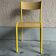Vintage yellow school chair