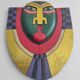 Handcrafted decorative wall mask made of painted wood.