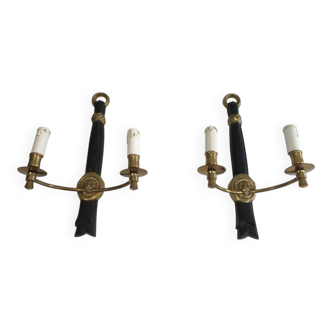 Pair of black lacquered bronze wall sconces decorated with lion heads