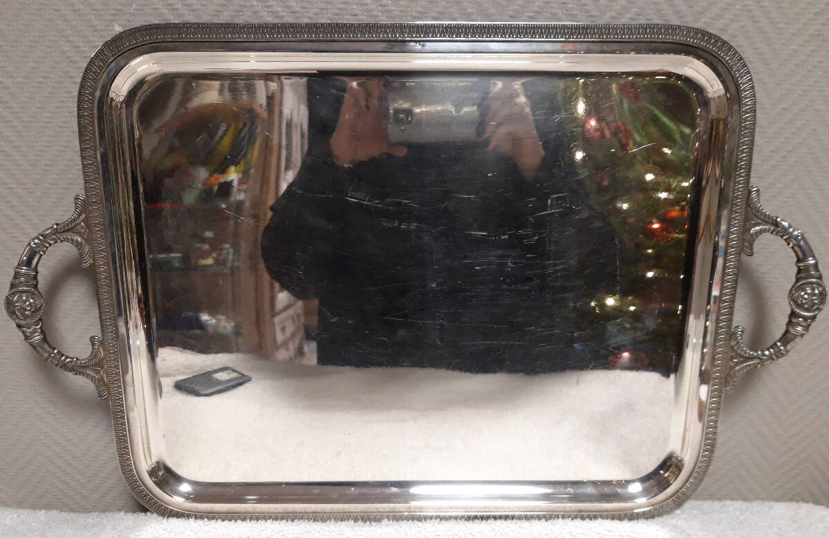 Silver-plated service tray with handles, neoclassical decoration.