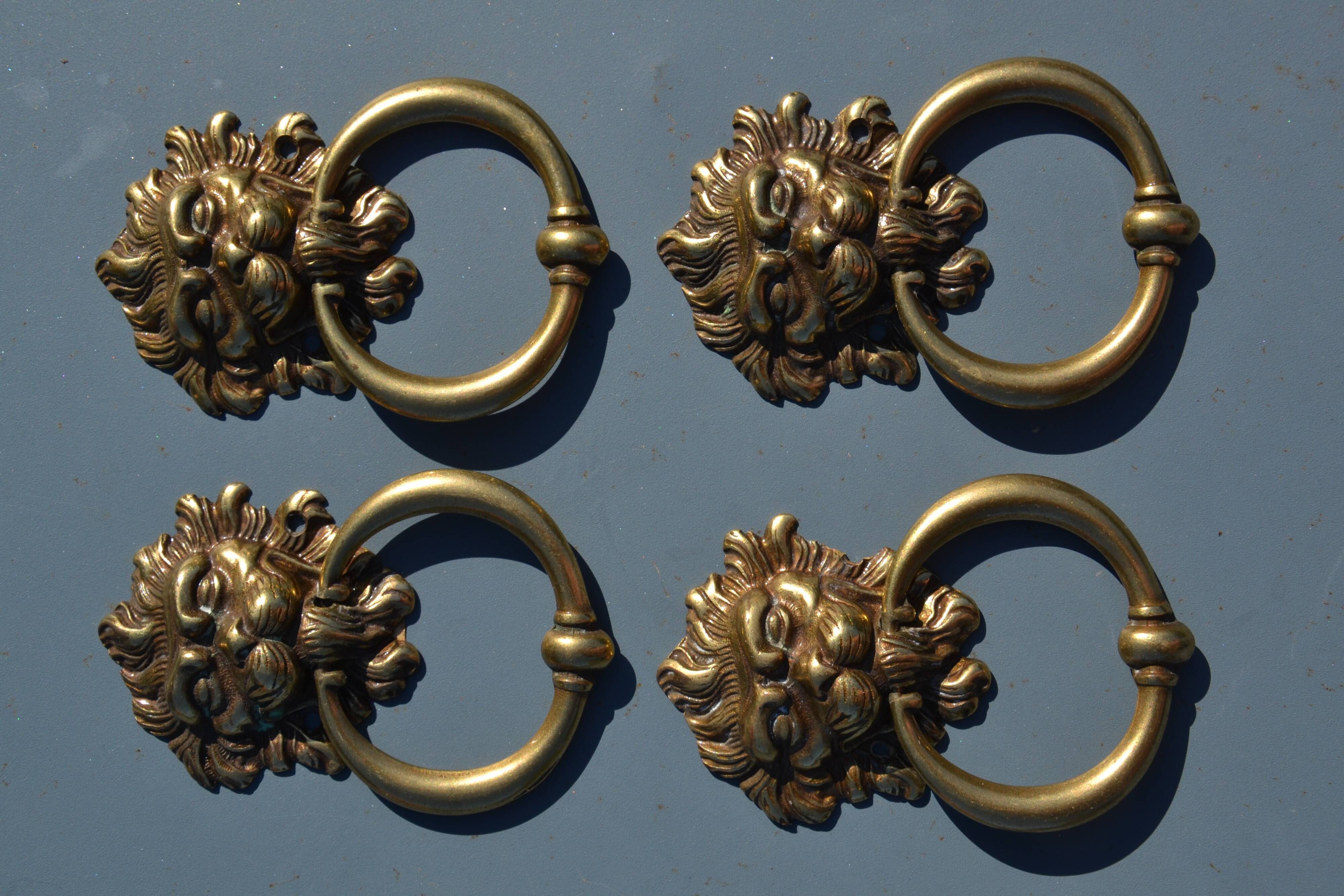 4 antique lion head furniture handles from La Samaritaine.