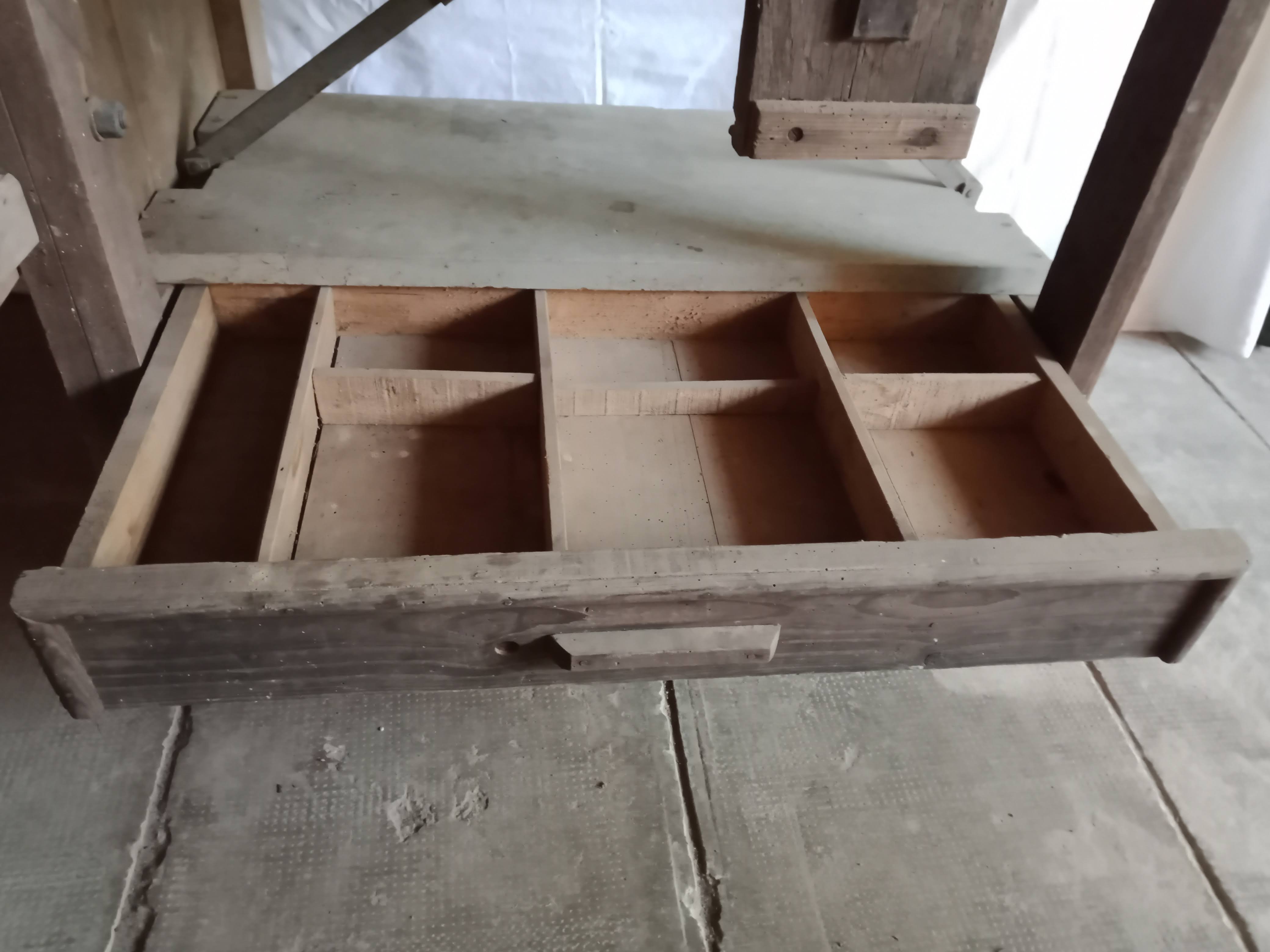 antique workbench with one drawer and two vices