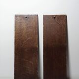 Pair of decorative wall panels in carved wood from the 19th century.