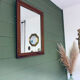 Antique mirror in carved wood and mercury 48x63cm