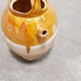 Old gargoulette pot in glazed terracotta