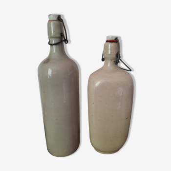 Pair of sandstone bottles