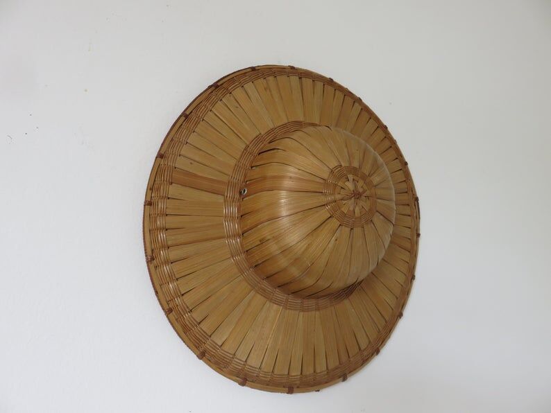 Colonial hat in bamboo and braided rattan, wall decoration