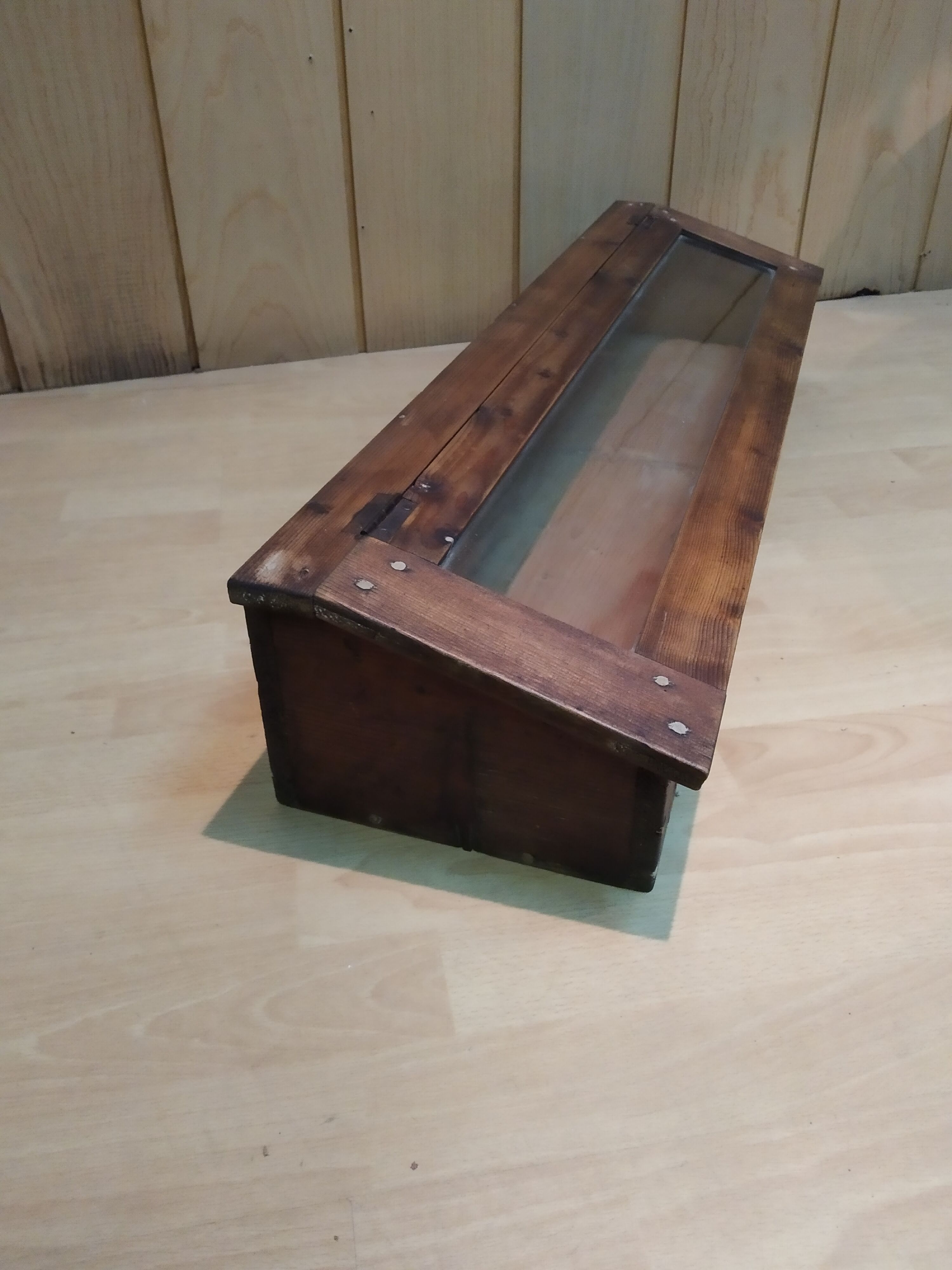 Former wooden display case