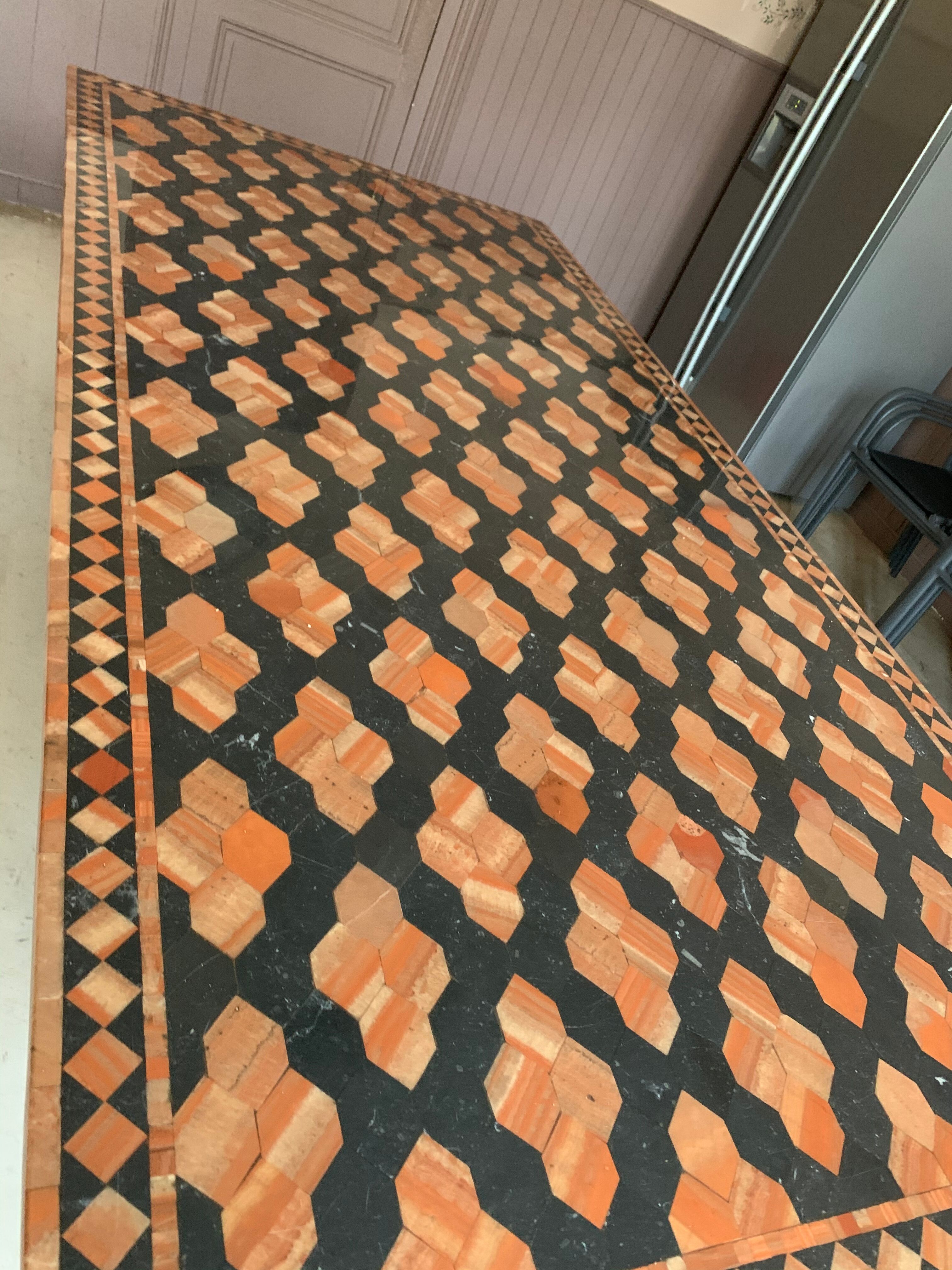 Wrought iron table on marble