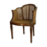 Old armchair with double cannage in walnut carved style Louis XVI of the nineteenth century