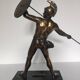 Large statue of Achilles, Greek warrior, marble base, ancient mythology.