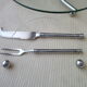 Cheese platter made of glass and silver metal and its serving cutlery