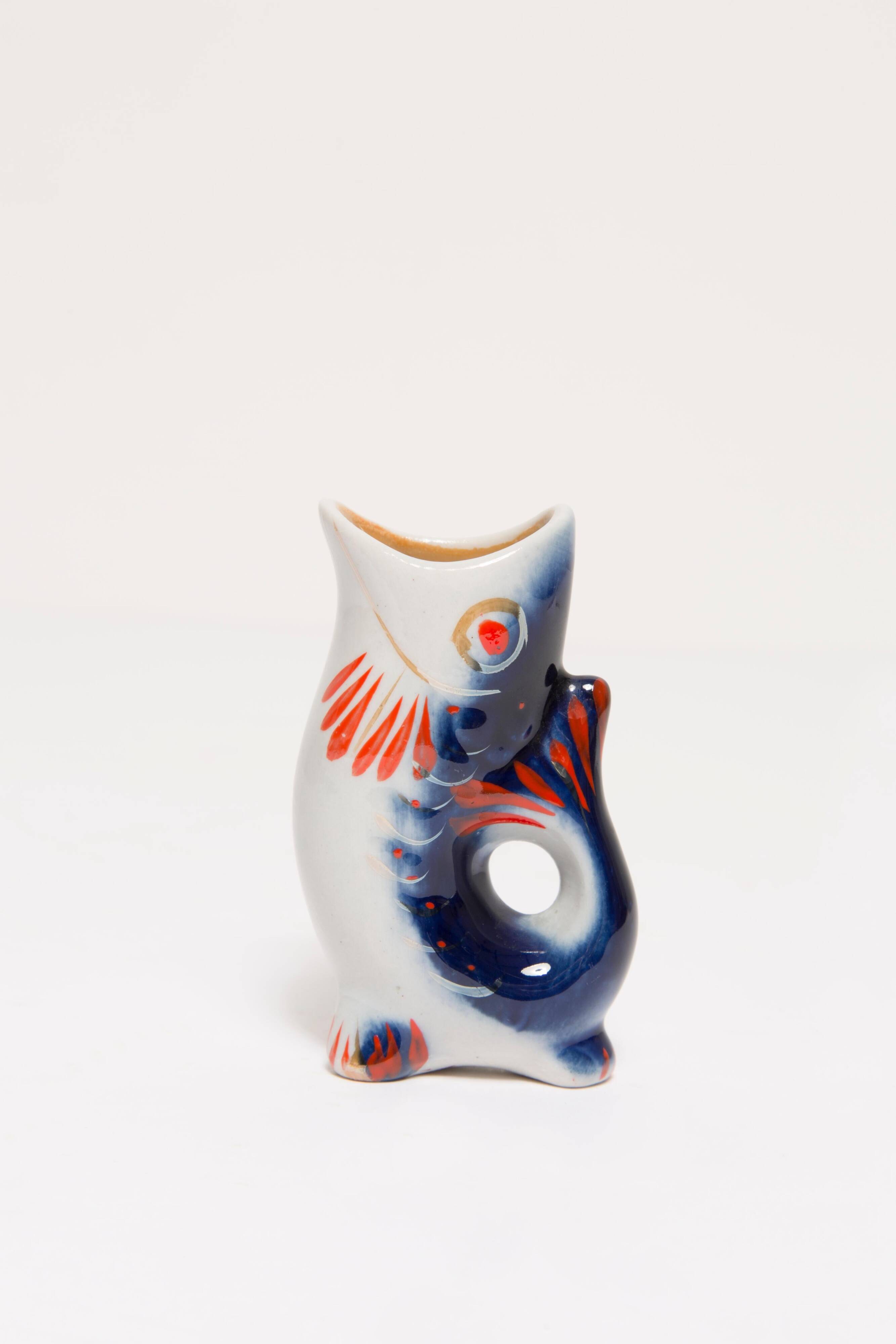 Set of 7 blue glass fish, mid-20th century.