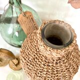 Glass bottle and braided rope