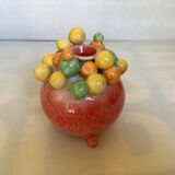 Small tripod vase with multicolored marbles