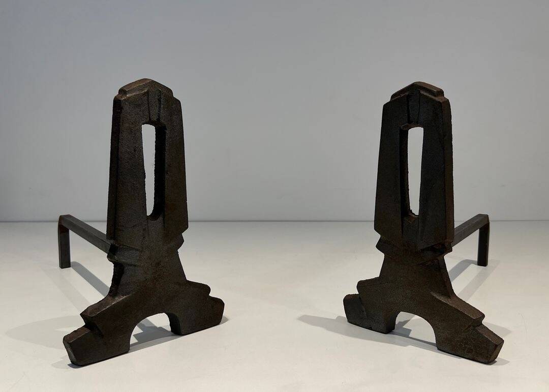 Pair of Modernist Andirons in Cast Iron with Openwork Uprights and Tripod Bases