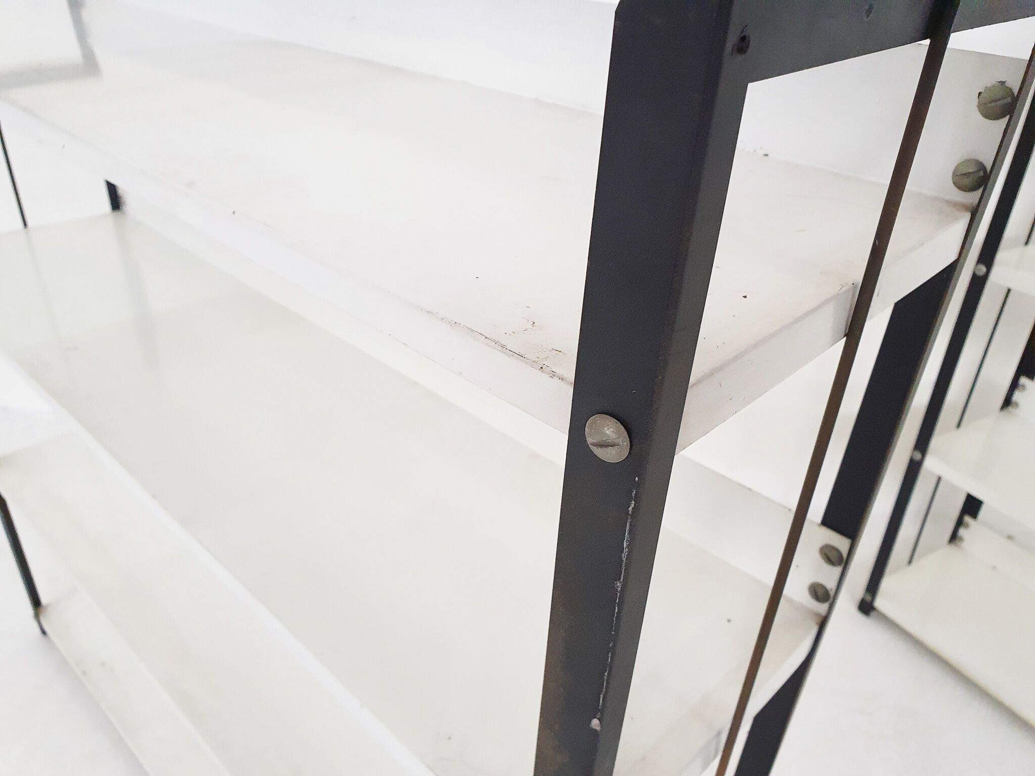 Set of two black and white metal book shelves attrb. to Tomado, Holland, 1950's