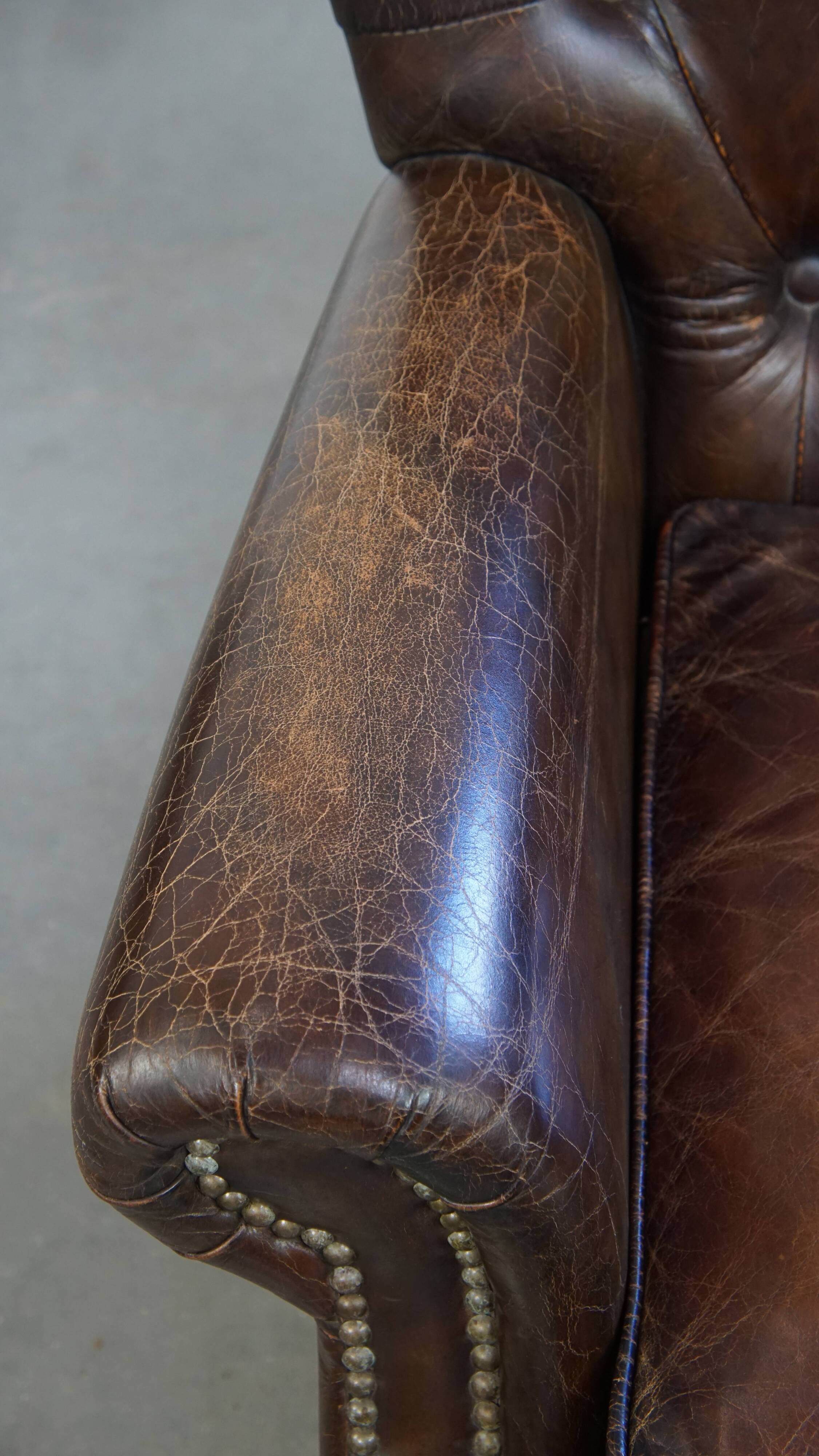 Cognac colored brown grained cowhide chesterfield armchair