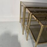 Set of three nesting tables in brass and smoked glass, 20th century