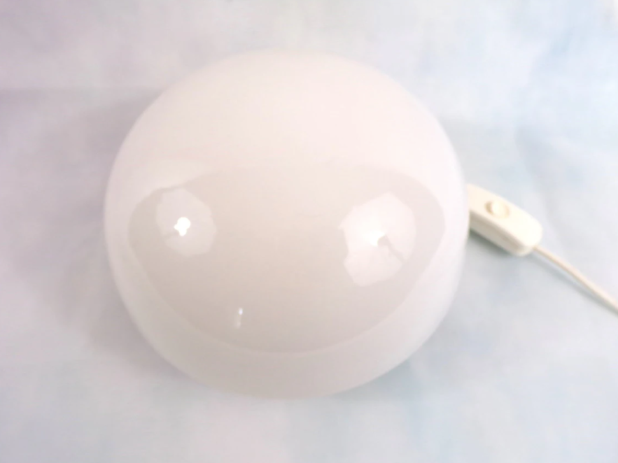 Opaline Scandinavian style bedside lamp on wood
