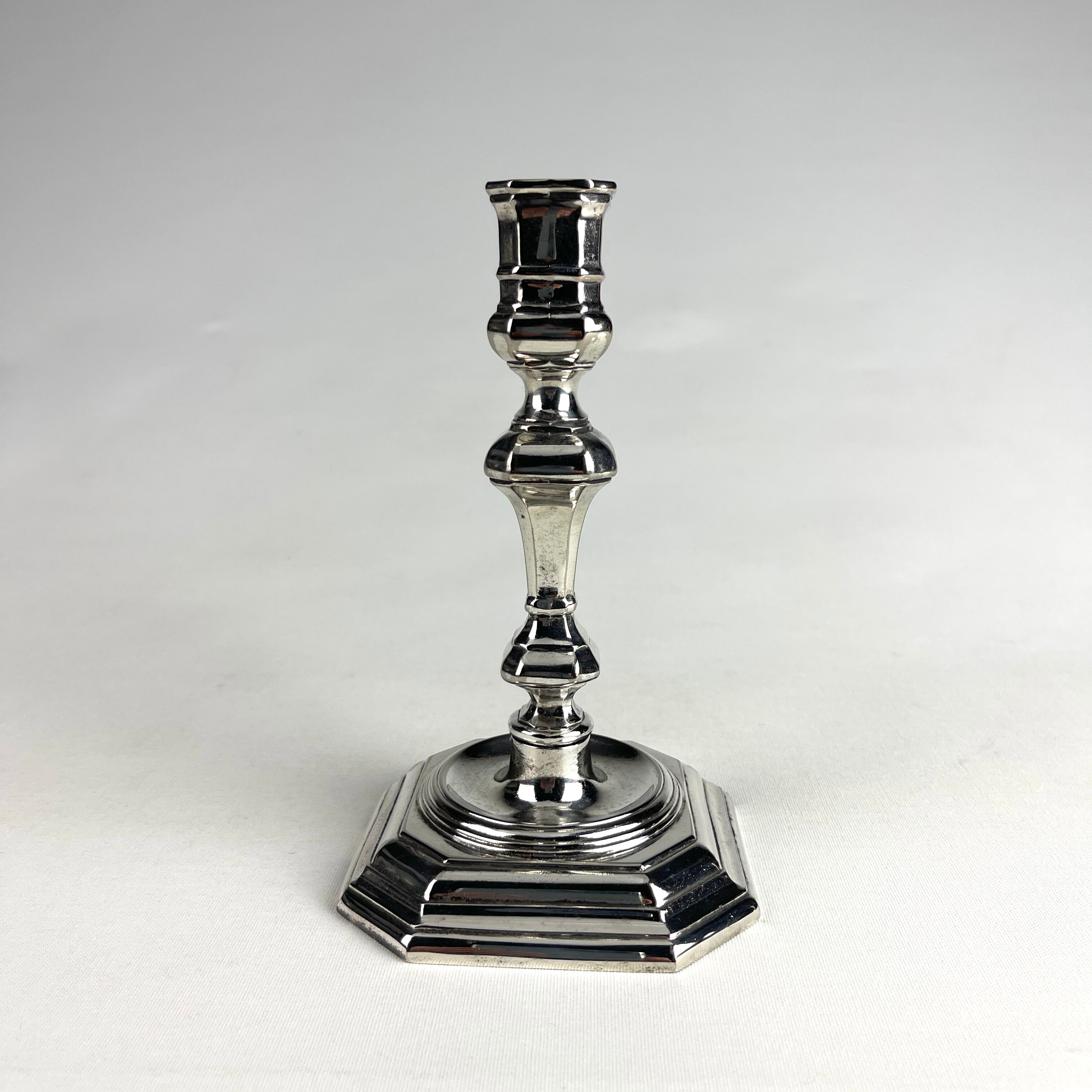 Pair of antique candlesticks in silver metal