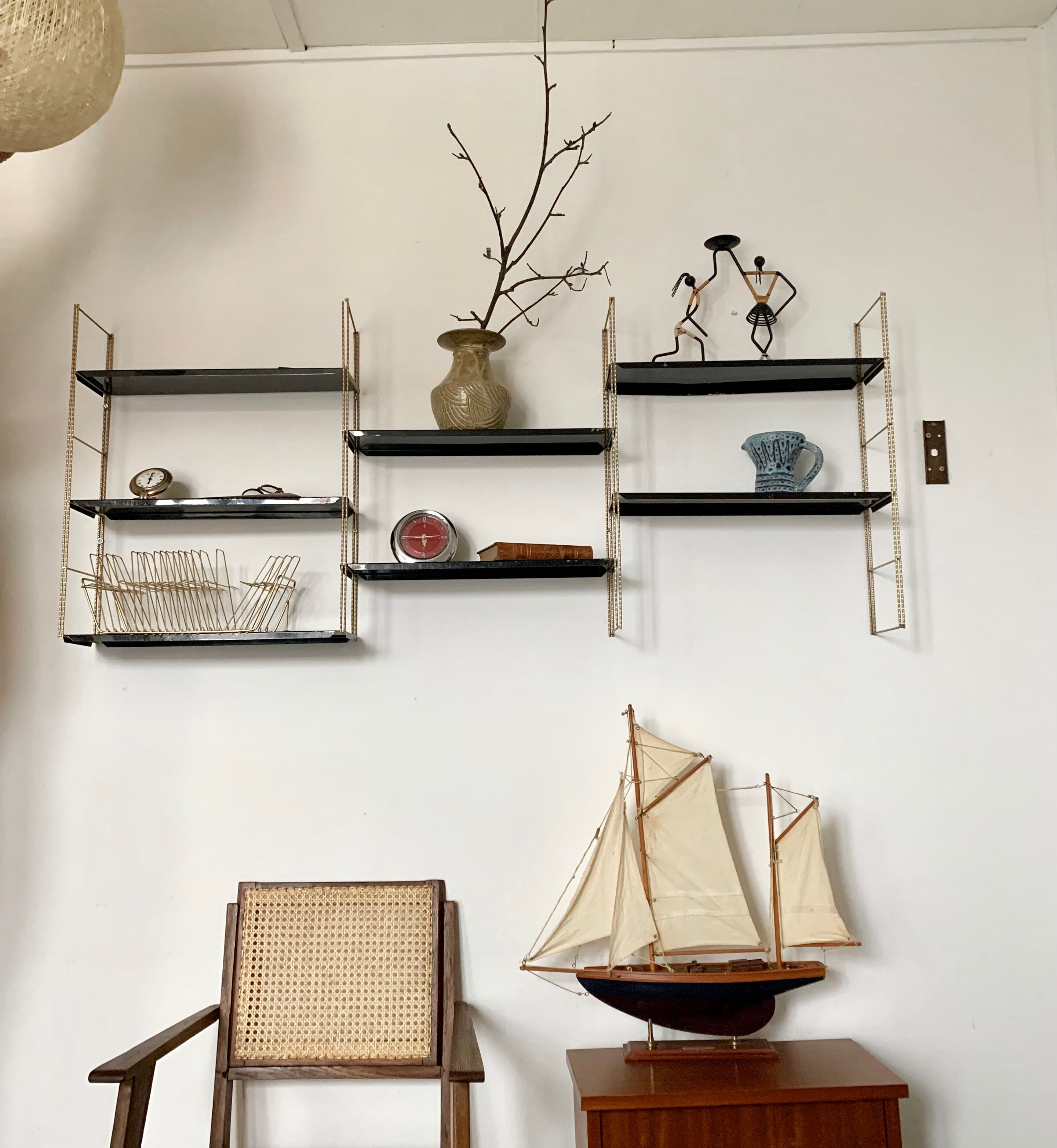 Vintage wall shelves in gold and black metal