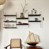 Vintage wall shelves in gold and black metal
