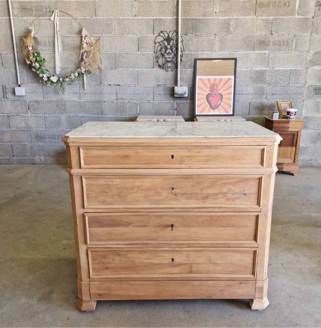 Walnut chest of drawers with white marble.