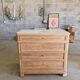 Walnut chest of drawers with white marble.