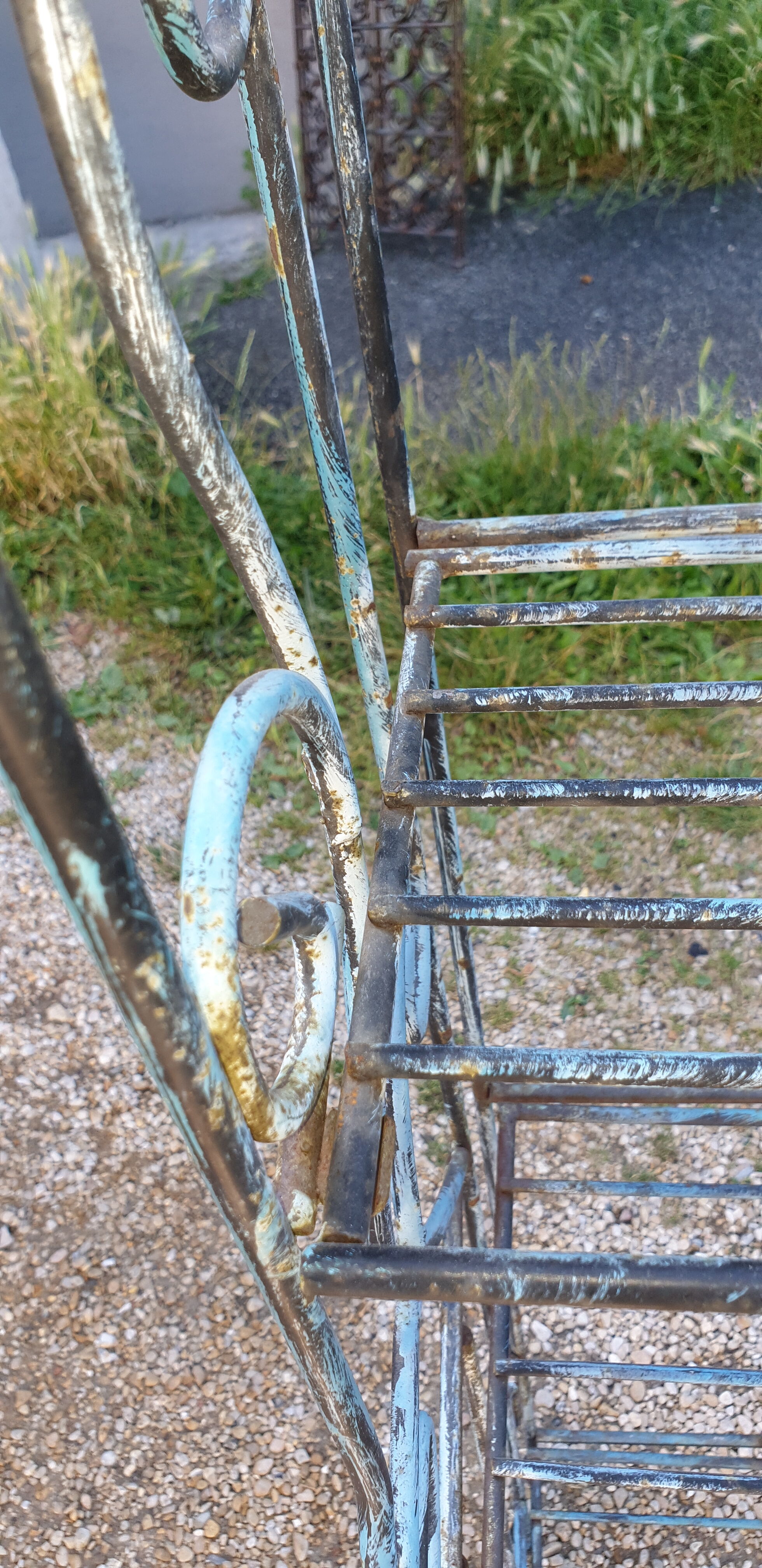Wrought iron shelf on worked feet